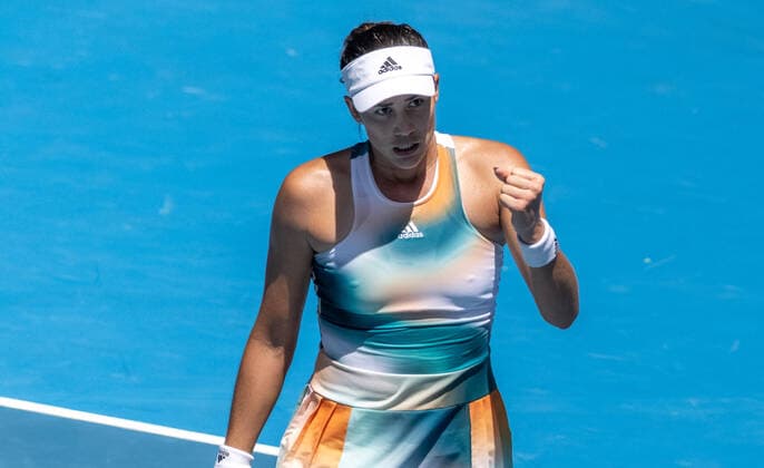 (220118) -- MELBOURNE, Jan. 18, 2022 -- Garbine Muguruza of Spain celebrates scoring during the women s singles match against Clara Burel of France at Australian Open in Melbourne Park, in Melbourne, Australia, on Jan. 18, 2022. (Photo by Hu Jingchen Xinhua) (SP)AUSTRALIA-MELBOURNE-AUSTRALIAN OPEN-WOMEN S SINGLES-FIRST ROUND BaixXuefei 