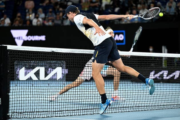 TENNIS AUSTRALIAN OPEN, John Millman of Australia runs into the net during his second round Men?s singles match against Alexander Zverev of Germany on Day 3 of the Australian Open, at Melbourne Park, in Melbourne, Wednesday, January 19, 2022. ( NO ARCHIVING, EDITORIAL USE ONLY, NO USE IN BOOKS WITHOUT CONSENT MELBOURNE VIC AUSTRALIA  Copyright: xDAVExHUNTx 20220119001614709422