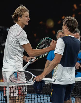 (220119) -- MELBOURNE, Jan. 19, 2022 -- Alexander Zverev of Germany shakes hands with John Millman of Australia after the Men s Singles second round match at Australian Open in Melbourne Park, in Melbourne, Australia, on Jan. 19, 2022. (Photo by Hu Jingchen Xinhua) (SP)AUSTRALIA-MELBOURNE-TENNIS-AUSTRALIAN OPEN-MEN S SINGLES BaixXuefei 