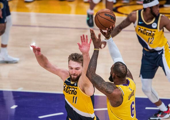 January 19, 2022, Los Angeles, California, USA: LeBron James 6 of the Los Angeles Lakers puts up a shot over Domantas Sabonis 11 of the Indiana Pacers during their NBA, Basketball Herren, USA game on Wednesday January 19, 2022 at Crypto.com Arena in Los Angeles, California. PI Los Angeles USA - ZUMAp124 20220119_zaa_p124_009 Copyright: xJAVIERxROJASx