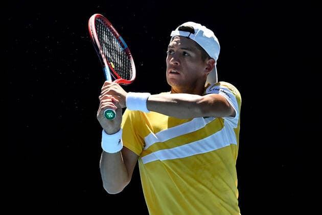 TENNIS AUSTRALIAN OPEN, Sebastian Baez of Argentina plays a shot during his second round Men?s singles match against Stefanos Tsitsipas of Greece on day 4 of the Australian Open at Melbourne Park in Melbourne, Thursday, January 20, 2022. ( NO ARCHIVING, EDITORIAL USE ONLY, NO USE IN BOOKS WITHOUT CONSENT MELBOURNE VICTORIA AUSTRALIA  Copyright: xJOELxCARRETTx 20220120001615101810