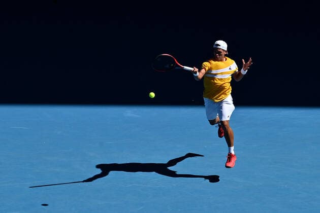 TENNIS AUSTRALIAN OPEN, Sebastian Baez of Argentina plays a shot during his second round Men?s singles match against Stefanos Tsitsipas of Greece on day 4 of the Australian Open at Melbourne Park in Melbourne, Thursday, January 20, 2022. ( NO ARCHIVING, EDITORIAL USE ONLY, NO USE IN BOOKS WITHOUT CONSENT MELBOURNE VICTORIA AUSTRALIA  Copyright: xJOELxCARRETTx 20220120001615103624