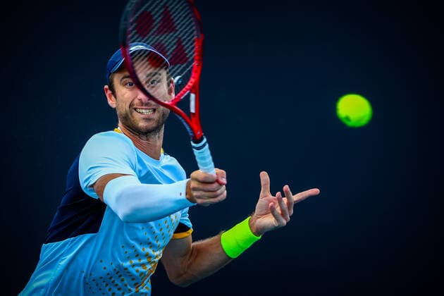 Belgian Sander Gille pictured in action during a tennis match between the Belgian pair Gille-Vliegen and the French pair Bonzi-Rinderknech, in the first round of the men s doubles at the Australian Open Grand Slam tennis tournament, Thursday 20 January 2022 in Melbourne Park, Melbourne, Australia. The 2022 edition of the Australian Grand Slam takes place from January 17th to January 30th. PATRICKxHAMILTON  x4066976x