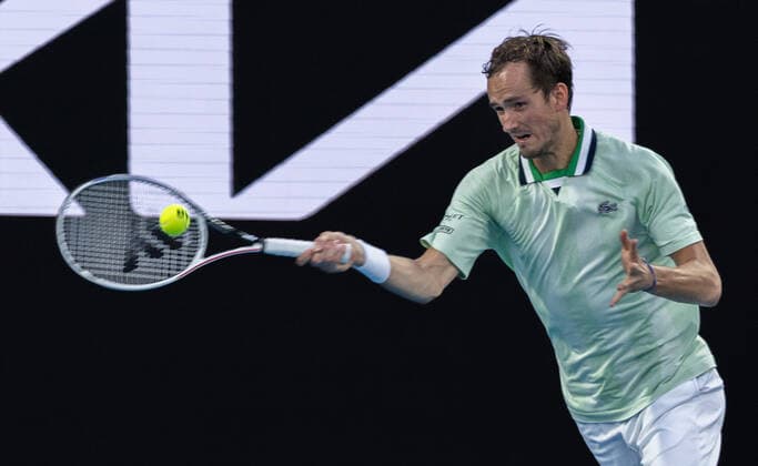 (220120) -- MELBOURNE, Jan. 20, 2022 -- Daniil Medvedev of Russia hits a return during the men s singles second round match between Daniil Medvedev of Russia and Nick Kyrgios of Australia at Australian Open 2022 in Melbourne, Australia, Jan. 20, 2022. (Photo by Xinhua) (SP)AUSTRALIA-MELBOURNE-TENNIS-AUSTRALIAN OPEN-MEN S SINGLES HuxJingchen 