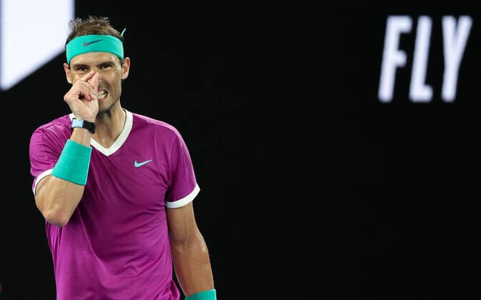 (220121) -- MELBOURNE, Jan. 21, 2022 -- Rafael Nadal of Spain reacts during the men s singles 3rd round match against Karen Khachanov of Russia at Australian Open in Melbourne Park, in Melbourne, Australia, Jan. 21, 2022. ) (SP)AUSTRALIA-MELBOURNE-TENNIS-AUSTRALIAN OPEN-MEN S SINGLES-THIRD ROUND BaixXuefei 