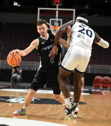 (220122) -- RIGA, Jan. 22, 2022 -- Kristers Zoriks (L) of VEF Riga vies with Gavin Ware of JDA Dijon Basket during the Europe Basketball Champions League Play-ins match between VEF Riga and JDA Dijon Basket in Riga, Latvia, Jan. 21, 2022. (Photo by Xinhua) (SP)LATVIA-RIGA-BASKETBALL-EUROPE CHAMPIONS LEAGUE-VEF RIGA VS JDA DIJON EdijsxPalens 