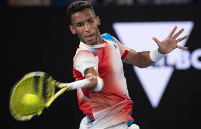 (220126) -- MELBOURNE, Jan. 26, 2022 -- Felix Auger-Aliassime of Canada competes during the men s single match between Felix Auger-Aliassime of Canada and Daniil Medvedev of Russia at Australian Open in Melbourne Park, in Melbourne, Australia, on Jan. 26, 2022. (Photo by Xinhua) (SP)AUSTRALIA-MELBOURNE-TENNIS-AUSTRALIAN OPEN-MEN S SINGLES-QUARTERFINALS HuxJingchen 