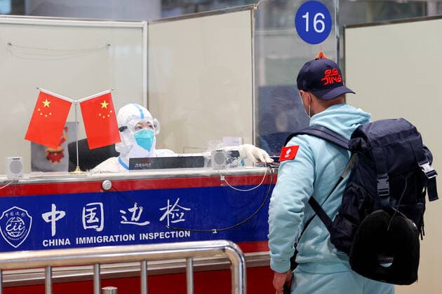 BEIJING, CHINA - JANUARY 28, 2022: A man goes through Passport Control at Beijing Capital International Airport ahead of the 2022 Winter Olympics. The 24th Winter Olympic Games, Olympische Spiele, Olympia, OS are scheduled to take place in Beijing on February 4-20, 2022. Sergei Bobylev TASS  TS1206CE