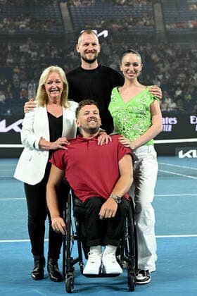 TENNIS AUSTRALIAN OPEN, Australian of the Year Dylan Alcott (centre) along with his mother Resie (left) brother Zack and partner Chantell Otten during a presentation following Alcott?s retirement from competitive tennis, on Day 12 of the Australian Open, at Melbourne Park, in Melbourne, Friday, January 28, 2022. ( NO ARCHIVING, EDITORIAL USE ONLY, NO USE IN BOOKS WITHOUT CONSENT MELBOURNE VIC AUSTRALIA  Copyright: xDAVExHUNTx 20220128001617806366