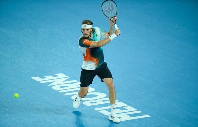 Mandatory Credit: Photo by Ella Ling Shutterstock (12775251db) Stefanos Tsitsipas in semi final action Australian Open, Day Twelve, Tennis, Melbourne Park, Melbourne, Australia - 28 Jan 2022 Australian Open, Day Twelve, Tennis, Melbourne Park, Melbourne, Australia - 28 Jan 2022 Copyright: xEllaxLing Shutterstockx 12775251db