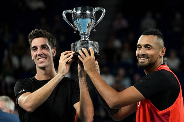TENNIS AUSTRALIAN OPEN, Thanasi Kokkinakis and Nick Kyrgios of Australia pose for photographs with the trophy after winning the Men?s doubles final against Matthew Ebden and Max Purcell of Australia on Day 13 of the Australian Open, at Melbourne Park, in Melbourne, Saturday, January 29, 2022. ( NO ARCHIVING, EDITORIAL USE ONLY, NO USE IN BOOKS WITHOUT CONSENT MELBOURNE VIC AUSTRALIA  Copyright: xDEANxLEWINSx 20220130001618112256