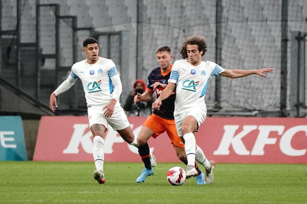 Matteo Guendouzi (Olympique de Marseille) - Arnaud Souquet (Montpellier FC) FOOTBALL : Olympique de Marseille vs Montpellier - de 8 eme de finale Coupe de France - Marseille - 29 02 2022 NorbertScanella Panoramic 