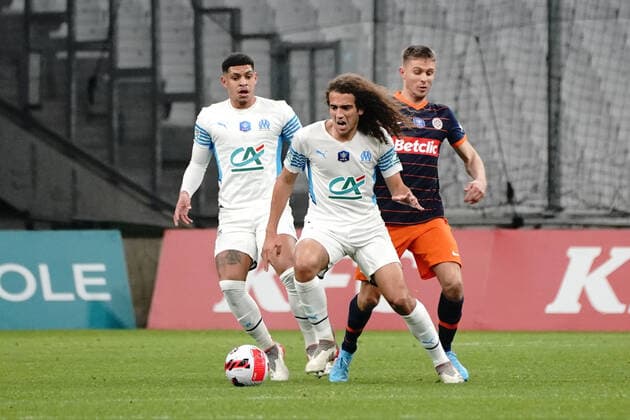Matteo Guendouzi (Olympique de Marseille) - Arnaud Souquet (Montpellier FC) FOOTBALL : Olympique de Marseille vs Montpellier - de 8 eme de finale Coupe de France - Marseille - 29 02 2022 NorbertScanella Panoramic 