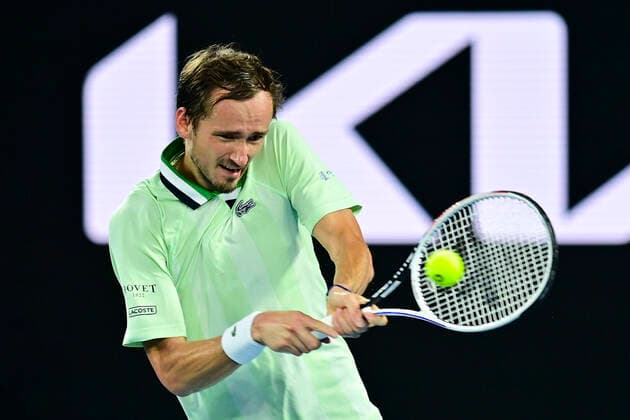 TENNIS AUSTRALIAN OPEN, Daniil Medvedev of Russia plays a shot during the men?s singles final against Rafael Nadal of Spain on Day 14 of the Australian Open at Melbourne Park in Melbourne, Sunday, January 30, 2022. ( NO ARCHIVING, EDITORIAL USE ONLY, NO USE IN BOOKS WITHOUT CONSENT MELBOURNE VIC AUSTRALIA  Copyright: xJOELxCARRETTx 20220130001618408601