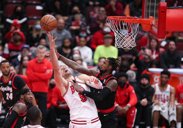 CHICAGO, IL - JANUARY 30: Chicago Bulls center Nikola Vucevic (9) is fouled by Portland Trail Blazers forward Trendon Watford (2) during a NBA, Basketball Herren, USA game between the Portland Trail Blazers and the Chicago Bulls on January 30, 2022 at the United Center in Chicago, IL. (Photo by Melissa Tamez Icon Sportswire) NBA: JAN 30 Trail Blazers at Bulls Icon22013045