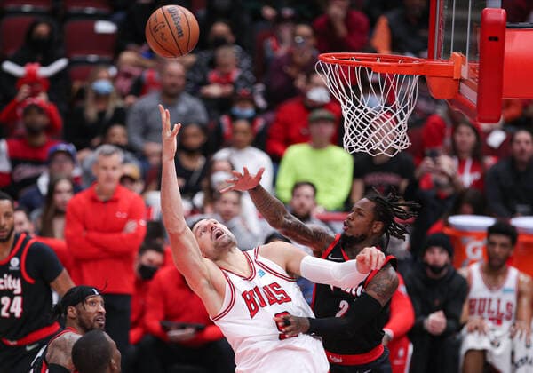 CHICAGO, IL - JANUARY 30: Chicago Bulls center Nikola Vucevic (9) is fouled by Portland Trail Blazers forward Trendon Watford (2) during a NBA, Basketball Herren, USA game between the Portland Trail Blazers and the Chicago Bulls on January 30, 2022 at the United Center in Chicago, IL. (Photo by Melissa Tamez Icon Sportswire) NBA: JAN 30 Trail Blazers at Bulls Icon22013046