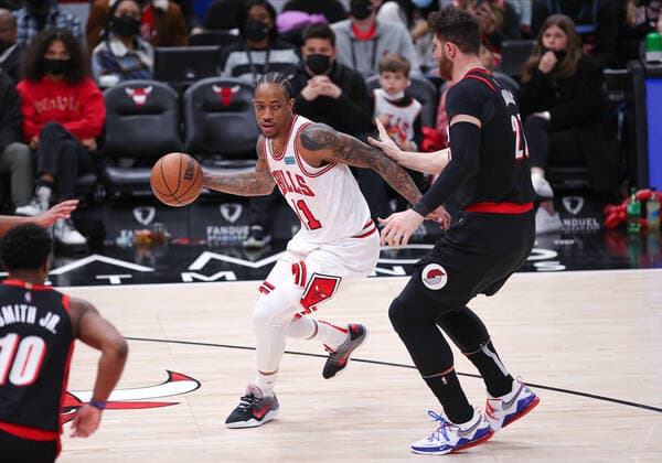 CHICAGO, IL - JANUARY 30: Chicago Bulls forward DeMar DeRozan (11) dribbles the ball while being defended by Portland Trail Blazers center Jusuf Nurkic (27) during a NBA, Basketball Herren, USA game between the Portland Trail Blazers and the Chicago Bulls on January 30, 2022 at the United Center in Chicago, IL. (Photo by Melissa Tamez Icon Sportswire) NBA: JAN 30 Trail Blazers at Bulls Icon22013061
