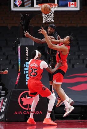 February 1, 2022, TORONTO, ON, CANADA: Miami Heat forward Jimmy Butler (22) and Toronto Raptors forward Scottie Barnes (4) jump for a rebound as forward Chris Boucher (25) looks on during first half NBA, Basketball Herren, USA basketball action in Toronto on Tuesday, February 1, 2022. Canada News - February 1, 2022  - ZUMAc35_ 20220201_zaf_c35_096 Copyright: xNathanxDenettex
