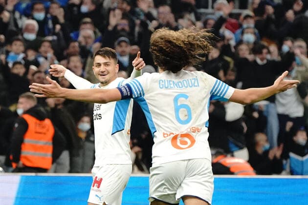 Fußball, Olympique Marseille - SCO Angers Joie - Cengiz Under (Olympique de Marseille) - Matteo Guendouzi (Olympique de Marseille) FOOTBALL : Olympique de Marseille vs SCO Angers - Ligue 1 Uber Eats - Marseille - 04 02 2022 NorbertScanella Panoramic 