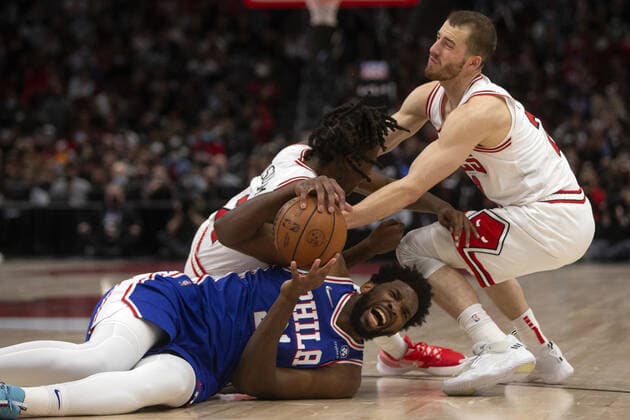 February 6, 2022: Philadelphia 76ers center Andre Drummond (1) collides with Chicago Bulls guard Ayo Dosunmu (12) and Chicago Bulls guard Matt Thomas (21) during the fourth quarter on Sunday, Feb. 6, 2022, at the United Center in Chicago. The Bulls lost the game 119-208. - ZUMAm67_ 0150045018st Copyright: xErinxHooleyx