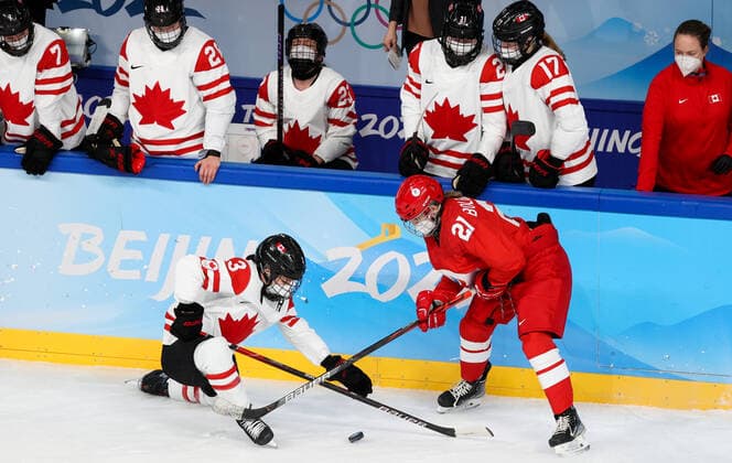 BEIJING, CHINA - FEBRUARY 7, 2022: Jocelyne Larocque (L) of Canada and Polina Bolgareva of the ROC Team fight for the puck in their women s Group A Ice hockey, Eishockey match at the 2022 Winter Olympic Games, Olympische Spiele, Olympia, OS at the Wukesong Sports Centre. Anton Novoderezhkin TASS  TS121B2A