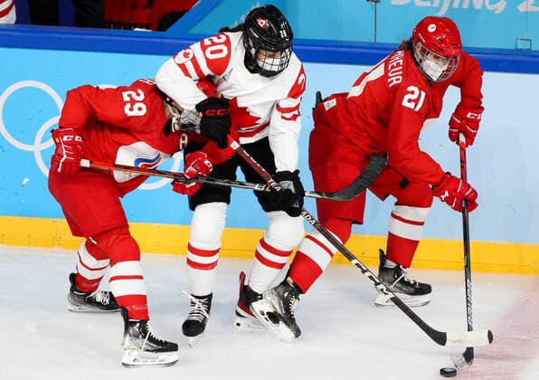 BEIJING, CHINA - FEBRUARY 7, 2022: Alexandra Vafina of the ROC Team, Sarah Nurse of Canada and Polina Bolgareva (L-R) of the ROC Team fight for the puck in their women s Group A Ice hockey, Eishockey match at the 2022 Winter Olympic Games, Olympische Spiele, Olympia, OS at the Wukesong Sports Centre. Anton Novoderezhkin TASS  TS121B2B
