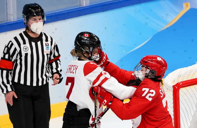 BEIJING, CHINA - FEBRUARY 7, 2022: Anna Savonina of the ROC Team and Laura Stacey (R-L) of Canada are in action in their women s Group A Ice hockey, Eishockey match at the 2022 Winter Olympic Games, Olympische Spiele, Olympia, OS at the Wukesong Sports Centre. Anton Novoderezhkin TASS  TS121B2D