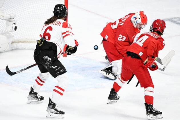 China Olympics 2022 Ice hockey, Eishockey Women ROC - Canada 8106791 07.02.2022 From left, Canada s Rebecca Johnston, Russian Olympic Committee s goaltender Daria Gredzen and Russian Olympic Committee s Yulia Smirnova struggle for a puck in the ice hockey women s preliminary round group A match between the Russian Olympic Committee s team and Canada during the Beijing 2022 Winter Olympic Games, Olympische Spiele, Olympia, OS at Wukesong Sports Centre in Beijing, China. Vladimir Astapkovich Sputnik Beijing China  Copyright: xVladimirxAstapkovichx