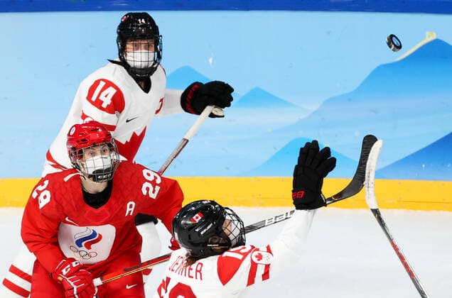 BEIJING, CHINA - FEBRUARY 7, 2022: Alexandra Vafina of the ROC Team and Renata Fast, Brianne Jenner (L-R) of Canada fight for the puck in their women s Group A Ice hockey, Eishockey match at the 2022 Winter Olympic Games, Olympische Spiele, Olympia, OS at the Wukesong Sports Centre. Anton Novoderezhkin TASS  TS121B55
