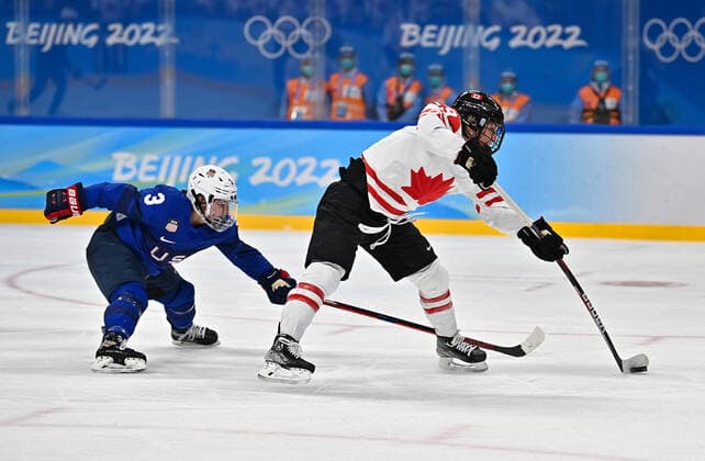 (220208) -- BEIJING, Feb. 8, 2022 -- Marie-Philip Poulin (R) of Canada shoots during the Ice hockey, Eishockey women s preliminary round group A match between Canada and the United States at Wukesong Sports Centre in Beijing, capital of China, Feb. 8, 2022. ) (BEIJING2022)CHINA-BEIJING-OLYMPIC Winter games, Winterspiele,Spiele, Summer games ICE HOCKEY-WOMEN S PRELIMINARY-CANADA VS U.S. (CN) SongxYanhua 
