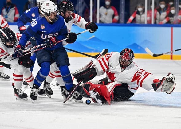 (220208) -- BEIJING, Feb. 8, 2022 -- Goalkeeper Ann-Renee Desbiens (1st R) of Canada makes a save during the Ice hockey, Eishockey women s preliminary round group A match between Canada and the United States at Wukesong Sports Centre in Beijing, capital of China, Feb. 8, 2022. ) (BEIJING2022)CHINA-BEIJING-OLYMPIC Winter games, Winterspiele,Spiele, Summer games ICE HOCKEY-WOMEN S PRELIMINARY-CANADA VS U.S. (CN) SongxYanhua 