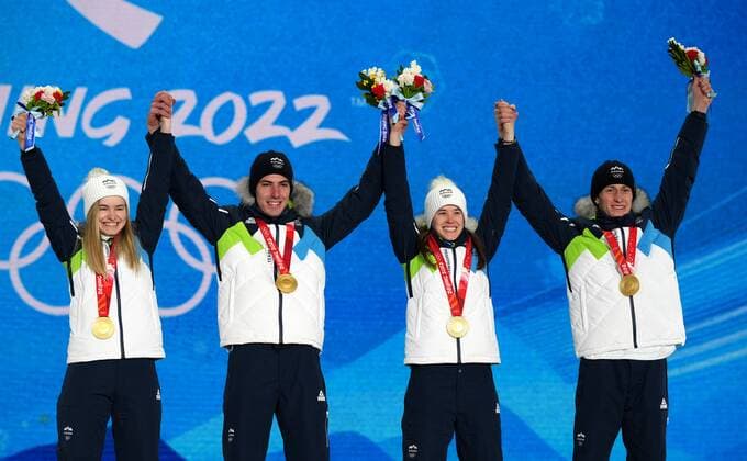 China Olympics 2022 Medal Ceremony 8108145 08.02.2022 Gold medalists Slovenia s Nika Kriznar, Timi Zajc, Ursa Bogataj and Peter Prevc celebrates on the podium during the medal ceremony for the Ski jumping, Skispringen, Ski, nordisch men s normal hill individual event of the Beijing 2022 Winter Olympic Games, Olympische Spiele, Olympia, OS at the Medals Plaza in Zhangjiakou, China. Ramil Sitdikov Sputnik Beijing China  Copyright: xRamilxSitdikovx