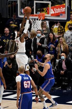 Denver Nuggets forward Will Barton 5, center, goes in for a basket against New York Knicks guard Evan Fournier 13, right, as New York Knicks center Taj Gibson 67, left, looks on during the first quarter at the Ball Arena in Denver, CO, USA, 08 February 2022. EPA Todd Pierson Denver Nuggets - New York Knicks !ACHTUNG: NUR REDAKTIONELLE NUTZUNG!  Copyright: xToddxPiersonx AME4543 20220209-0345be0c3295b7d62bdc868dc030db9d42b32cb5