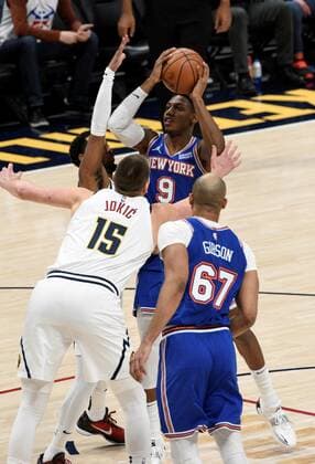 New York Knicks guard RJ Barrett 9, center right, goes up for a shot against Denver Nuggets center Nikola Jokic 15, center left, and Denver Nuggets guard Monte Morris 11, left, as New York Knicks center Taj Gibson 67, right looks on during the first quarter at the Ball Arena in Denver, CO, USA, 08 February 2022. EPA Todd Pierson Denver Nuggets - New York Knicks !ACHTUNG: NUR REDAKTIONELLE NUTZUNG! Copyright: xToddxPiersonx AME4545 20220209-01f39052d0250a7b1ac9693999859d014ab9c7d6