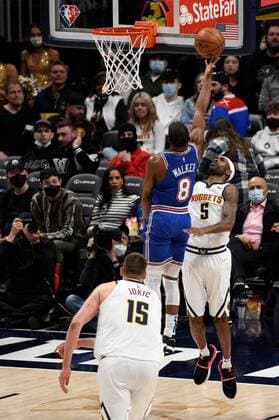 New York Knicks guard Kemba Walker (C) goes in for a basket against Denver Nuggets forward Will Barton during a NBA, Basketball Herren, USA game at the Ball Arena in Denver, CO, USA, 08 February 2022. Denver Nuggets - New York Knicks !ACHTUNG: NUR REDAKTIONELLE NUTZUNG!  Copyright: xToddxPiersonx AME4577 20220209-9864d34418da94c081e46f329b94569a28a88f9c
