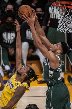 February 8, 2022, Los Angeles, California, USA: Giannis Antetokounmpo 34 of the Milwaukee Bucks gets a pass over Trevor Ariza 1 of the Los Angeles Lakers during their NBA, Basketball Herren, USA game on Tuesday February 8, 2022 at Crypto.com Arena in Los Angeles, California. Lakers lose to Bucks, 116-131. PI Los Angeles USA - ZUMAp124 20220208_zaa_p124_005 Copyright: xJAVIERxROJASx