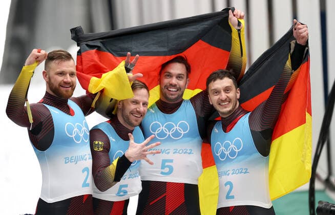 BEIJING, CHINA - FEBRUARY 9, 2022: Gold medalists Tobias Wendl (2nd R) and Tobias Arlt (2nd L), silver medalists Toni Eggert (L) and Sascha Benecken (R) of Germany pose for a photo after a men s luge doubles run at the 2022 Winter Olympic Games, Olympische Spiele, Olympia, OS at the Yanqing National Sliding Centre. Anton Novoderezhkin TASS  TS122214