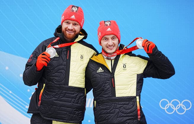(220209) -- BEIJING, Feb. 9, 2022 -- Silver medalists Toni Eggert Sascha Benecken of Germany celebrate during the awarding ceremony of luge doubles run at the Yanqing National Sliding Centre in Yanqing district of Beijing, capital of China, Feb. 9, 2022. ) (BEIJING2022)CHINA-BEIJING-YANQING-OLYMPIC Winter games, Winterspiele,Spiele, Summer games LUGE-DOUBLES (CN) JiangxWenyao 