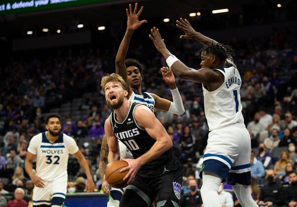 February 9, 2022, Sacramento, CA, USA: Sacramento Kings center Domantas Sabonis (13) drives to the basket against Minnesota Timberwolves forward Anthony Edwards (1) in the second quarter during a game at Golden 1 Center on Wednesday, Feb. 9, 2022 in Sacramento. Sacramento USA - ZUMAj89_ 20220209_zaf_j89_025 Copyright: xPaulxKitagakixJr.x