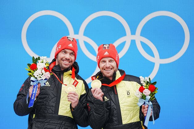 (220209) -- BEIJING, Feb. 9, 2022 -- Gold medalists Tobias Wendl Tobias Arlt of Germany celebrate during the awarding ceremony of luge doubles run at the Yanqing National Sliding Centre in Yanqing district of Beijing, capital of China, Feb. 9, 2022. ) (BEIJING2022)CHINA-BEIJING-YANQING-OLYMPIC Winter games, Winterspiele,Spiele, Summer games LUGE-DOUBLES (CN) JiangxWenyao 