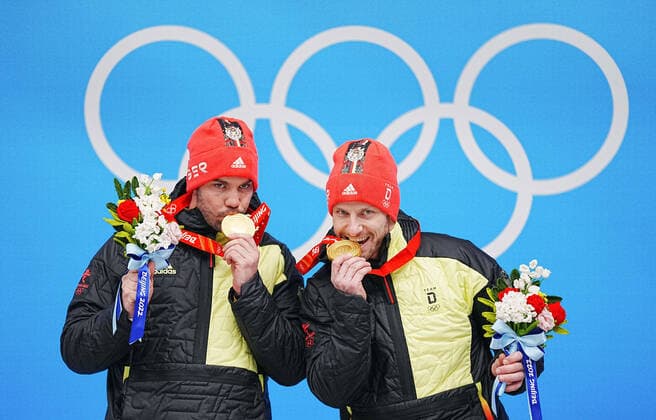 (220209) -- BEIJING, Feb. 9, 2022 -- Gold medalists Tobias Wendl Tobias Arlt of Germany celebrate during the awarding ceremony of luge doubles run at the Yanqing National Sliding Centre in Yanqing district of Beijing, capital of China, Feb. 9, 2022. ) (BEIJING2022)CHINA-BEIJING-YANQING-OLYMPIC Winter games, Winterspiele,Spiele, Summer games LUGE-DOUBLES (CN) JiangxWenyao 