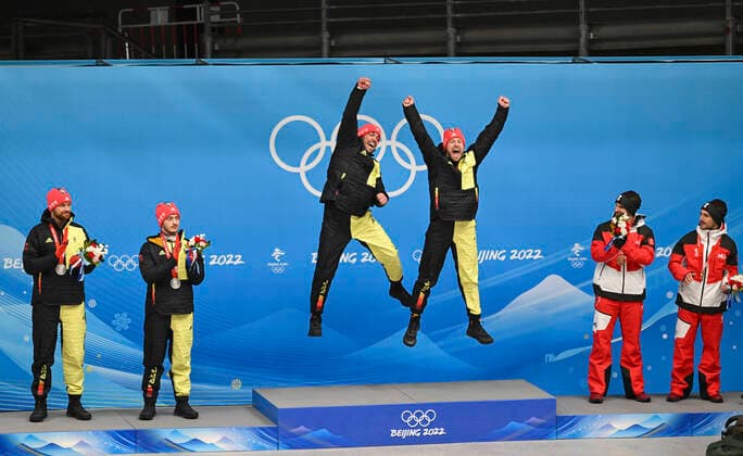 BEIJING, CHINA - FEBRUARY 09: Gold medalists Tobias Wendl and Tobias Arlt of Team Germany, silver medalists Toni Eggert and Sascha Benecken of Team Germany, bronze medalists Thomas Steu and Lorenz Koller of Austria celebrate at a flower ceremony for the Luge Doubles Run 2 on day five of the Beijing 2022 Winter Olympic Games, Olympische Spiele, Olympia, OS at Yanqing National Sliding Centre on February 9, 2022 in Beijing, China.  Copyright: xVCGx CFP111368571398 