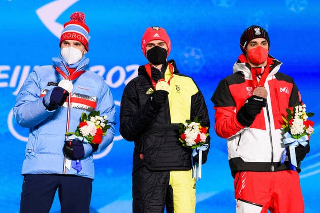 220210 Jorgen Graabak of Norway, Vinzenz Geiger of Germany and Lukas Greiderer of Austria celebrates with medals at the medal ceremony for men?s nordic combined individual during day 6 of the 2022 Winter Olympics on February 10, 2022 in Zhangjiakou. Photo: Vegard Grott BILDBYRAN kod VG VG0235 skidor nordic combined nordisk komination Olympic Games, Olympische Spiele, Olympia, OS olympics winter olympics os ol olympiska spel vinter-os olympiske leker peking peking 2022 beijing 2022 beijing 2022 olympic games beijing 2022 winter olympic games peking-os beijing-ol vinter-ol bbeng medaljeseremoni medaljceremoni medal ceremony norge norway celebration jubel silver Copyright: VEGARDxGRoTT BB220210VG051