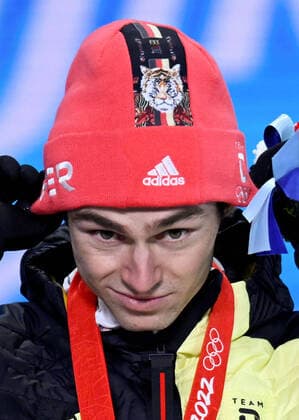 (220210) -- ZHANGJIAKOU, Feb. 10, 2022 -- Gold medalist Vinzenz Geiger of Germany reacts during the awarding ceremony of Nordic Combined Individual Gundersen Normal Hill 10km at Zhangjiakou Medals Plaza of the Winter Olympics in Zhangjiakou, north China s Hebei Province, Feb. 10, 2022. ) (BEIJING2022)CHINA- ZHANGJIAKOU-OLYMPIC Winter games, Winterspiele,Spiele, Summer games AWARDING CEREMONY (CN) DaixTianfang 