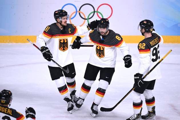 RIEDER Tobias Team GER Jubel mit Kapitaen MUELLER Moritz und NOEBELS Marcel Eishockey Spiel Vorrunde Kanada - Deutschland am Donnerstag den 10.02.2022 in Beijing Olympische Winterspiele 2022 in Peking China