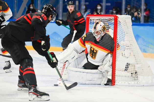Canada s Adam Tambellini and German Mathias Niederberger pictured in action during the match Canada versus Germany in the men s Ice hockey, Eishockey tournament, at the Beijing 2022 Winter Olympics in Beijing, China, Thursday 10 February 2022. The winter Olympics are taking place from 4 February to 20 February 2022. LAURIExDIEFFEMBACQ  x8739390x