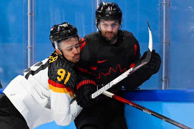 German Moritz Muller and Canada s David Desharnais pictured in action during the match Canada versus Germany in the men s Ice hockey, Eishockey tournament, at the Beijing 2022 Winter Olympics in Beijing, China, Thursday 10 February 2022. The winter Olympics are taking place from 4 February to 20 February 2022. LAURIExDIEFFEMBACQ  x8739440x