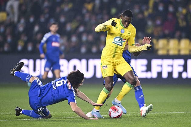 Randal Kolo Muani (Nantes) vs Dominique Guidi (Bastia) Joris Sainati (Bastia) FOOTBALL : FC Nantes vs SC Bastia - Coupe de France - 10 02 2022 JBAutissier Panoramic 