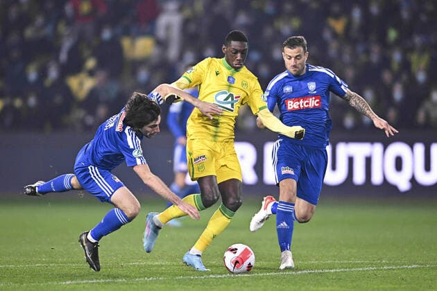 Randal Kolo Muani (Nantes) vs Dominique Guidi (Bastia) Joris Sainati (Bastia) FOOTBALL : FC Nantes vs SC Bastia - Coupe de France - 10 02 2022 JBAutissier Panoramic 