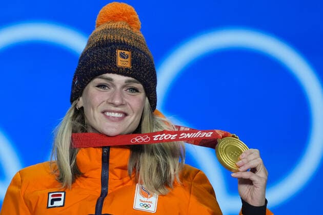 Irene Schouten of the Netherland s smiles with her gold medal during a medals ceremony for the Women s Speed skating, Eisschnelllauf 5000m race at the Beijing 2022 Winter Olympics on Friday, February 11, 2022.  OLY2022021128 PaulxHanna